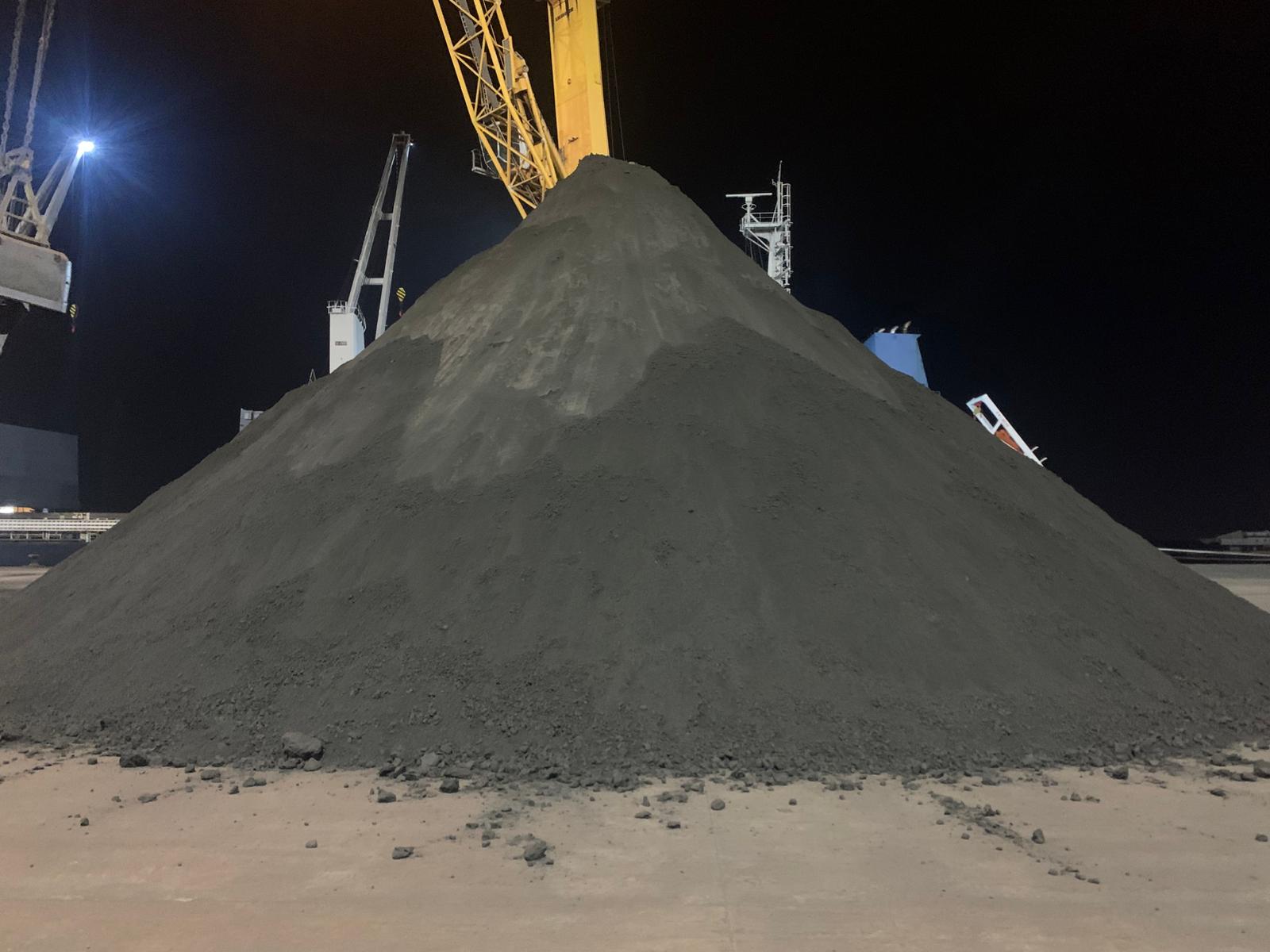 Concentrate stockpile on the quay being weighed and supervised at Huelva, Spain